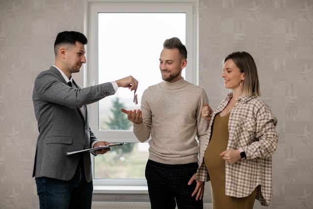 landlord passing keys to tenants